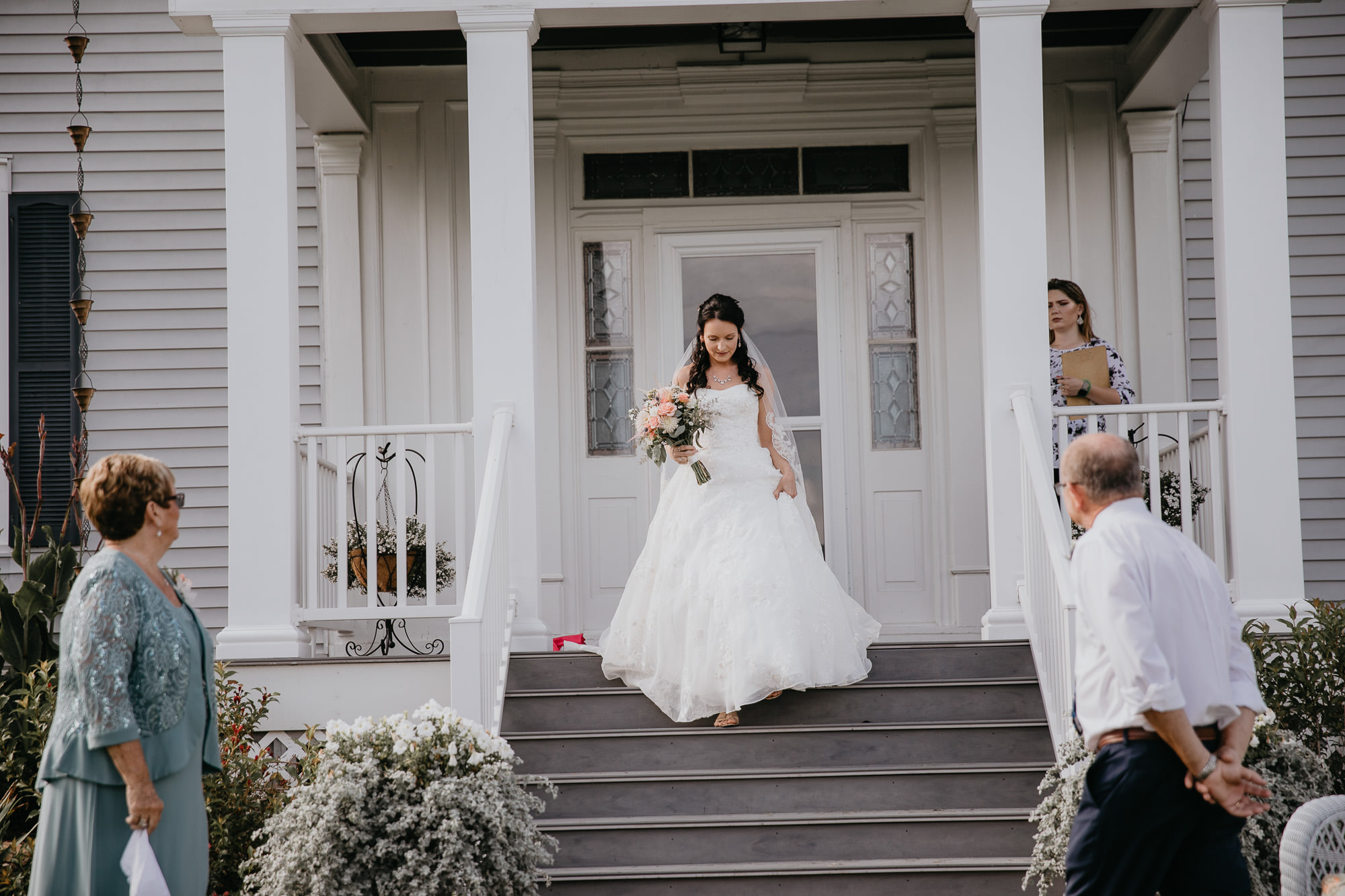 bride walking down steps at a Virginia wedding venue to get married.