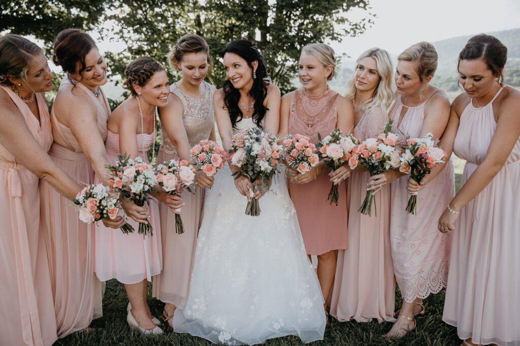 Photo By Pat Cori Photography a group of ladies bride and bridesmaids with flowers at A VA wedding.