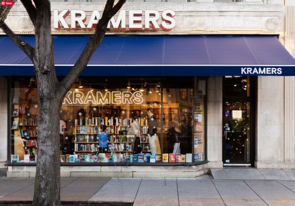 Photo of the bookstore front a Kramers books with glass front and books on shelves people inside looking at books. Date ideas for Washington DC.