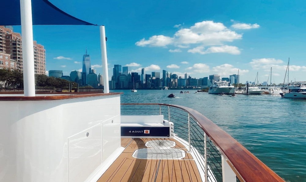 Photo of the DC Hot Tub Boat on a tour showing the coastline and skyline of DC. Great things to do in DC.