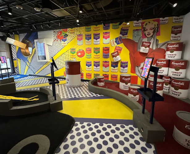 Photo inside Puttery of a mini golf course with Campbells soup theme.