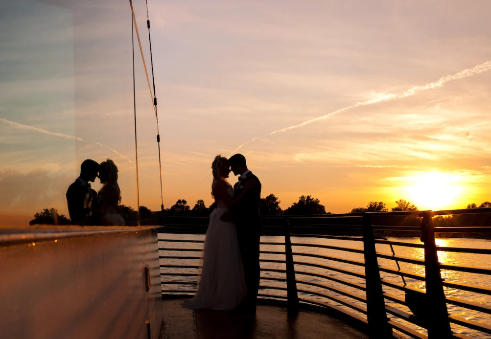 Couple holding each other on the Spirit Dinner Cruise at sunset. Great things to do in Dc.