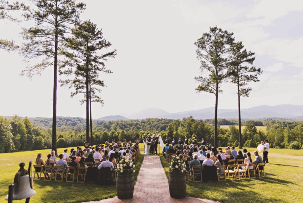 Beautiful ceremony space with a wedding happening with rolling mountains in the background. The most beautiful Virginia Wedding Venue.
