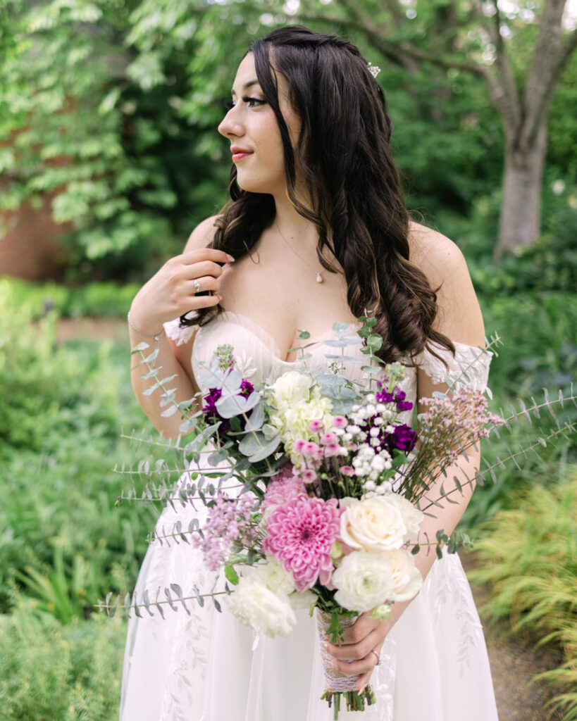 bride holding her lavender, sage and white bridal bouquet