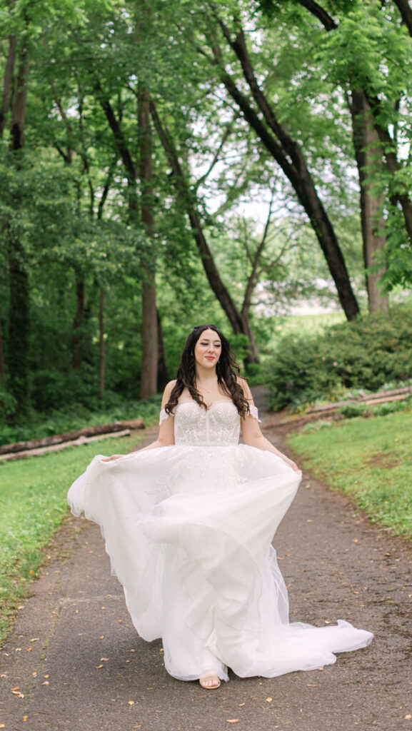 bride walking down the gardens 