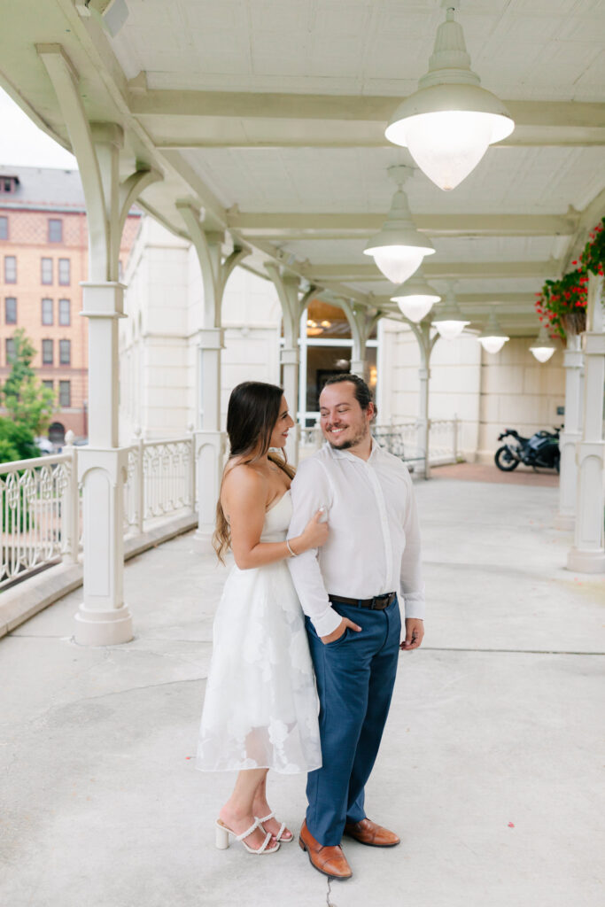 couple dressed up in white in front of hotel roanoke
