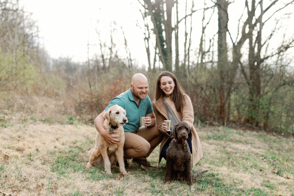 couple posing with dogs at the greenway
