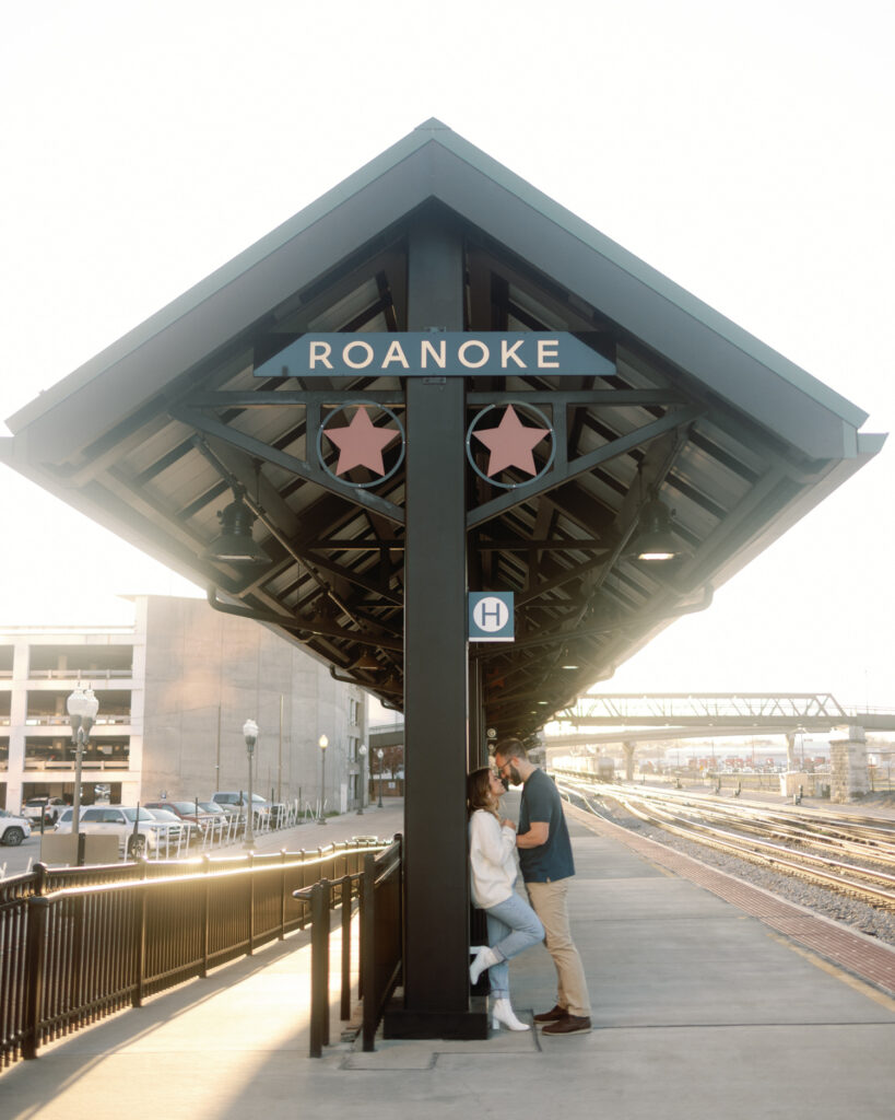 couple kissing at train station in roanoke