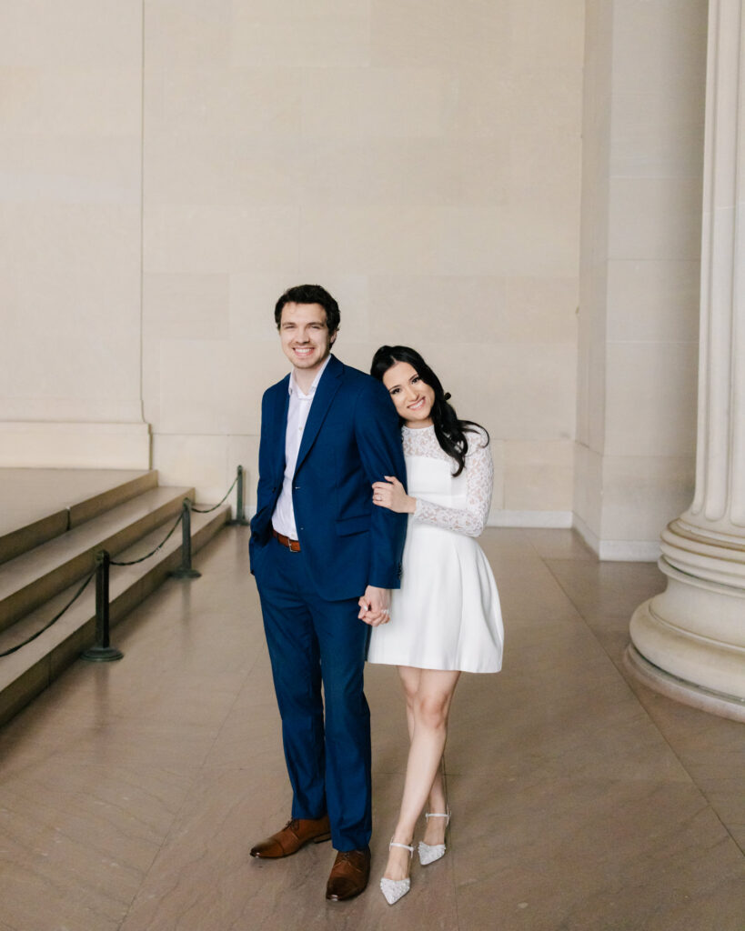 couple posing for their engagement pictures at lincoln memorial in washington DC