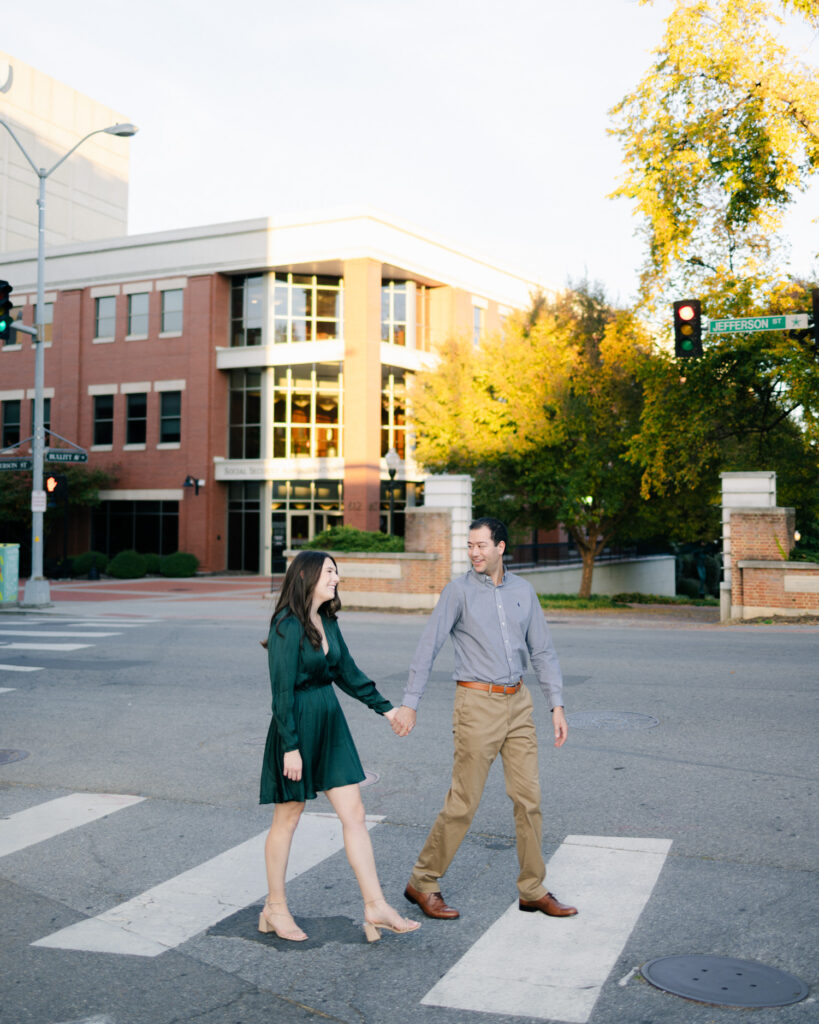 couple walking holding hands in downtown roanoke