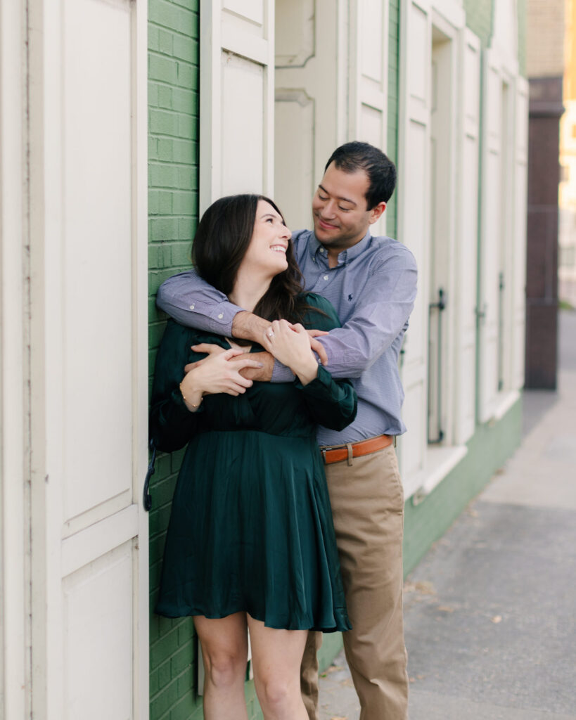 couple in love in front of green building