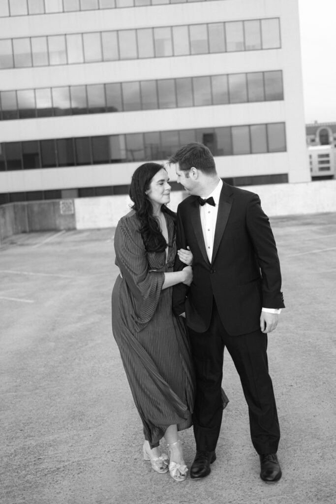couple at parking garage for engagement photos in roanoke