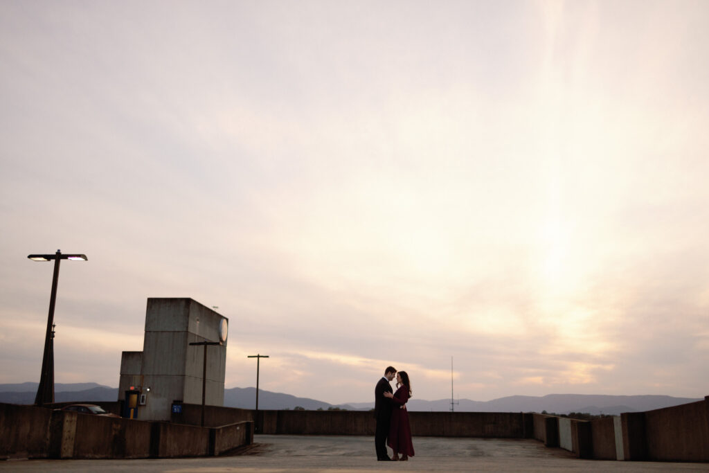 silhouette of couple at parking garage for engagement photos in roanoke