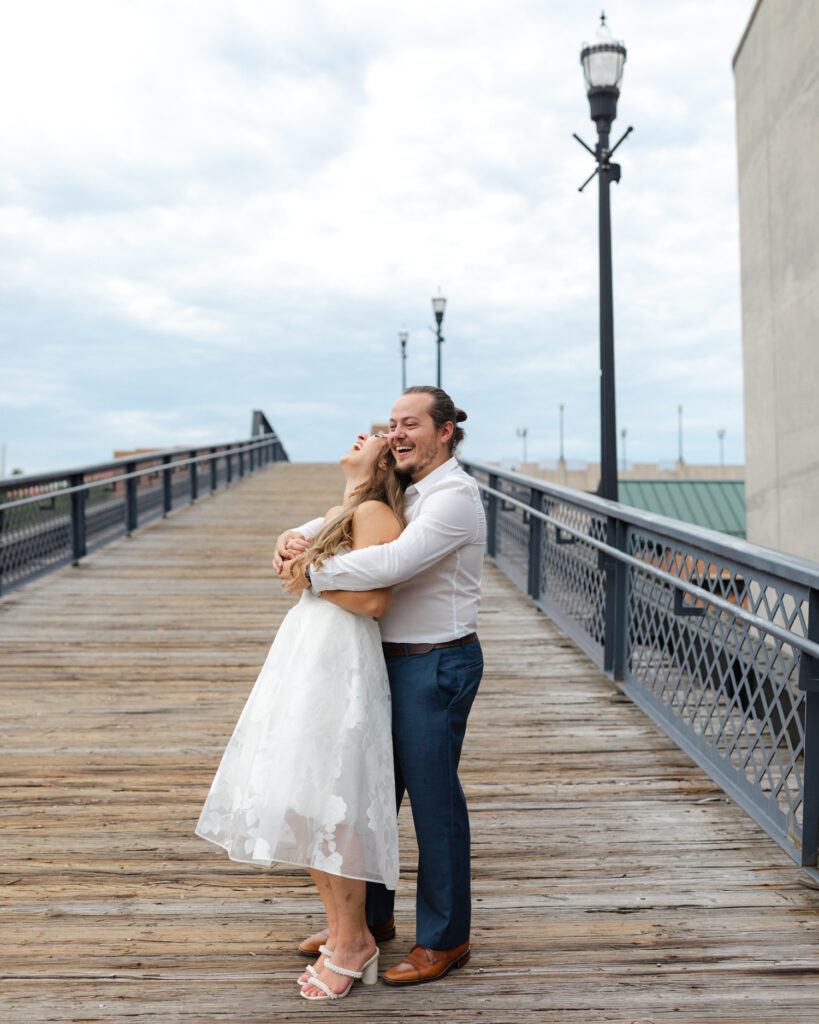 couple laughing on bridge in roanoke