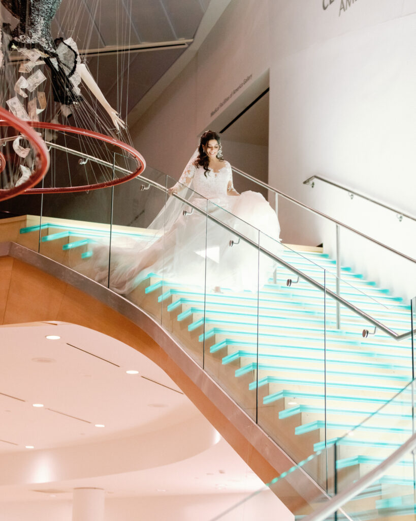 bride walking down staircase at the taubman museum