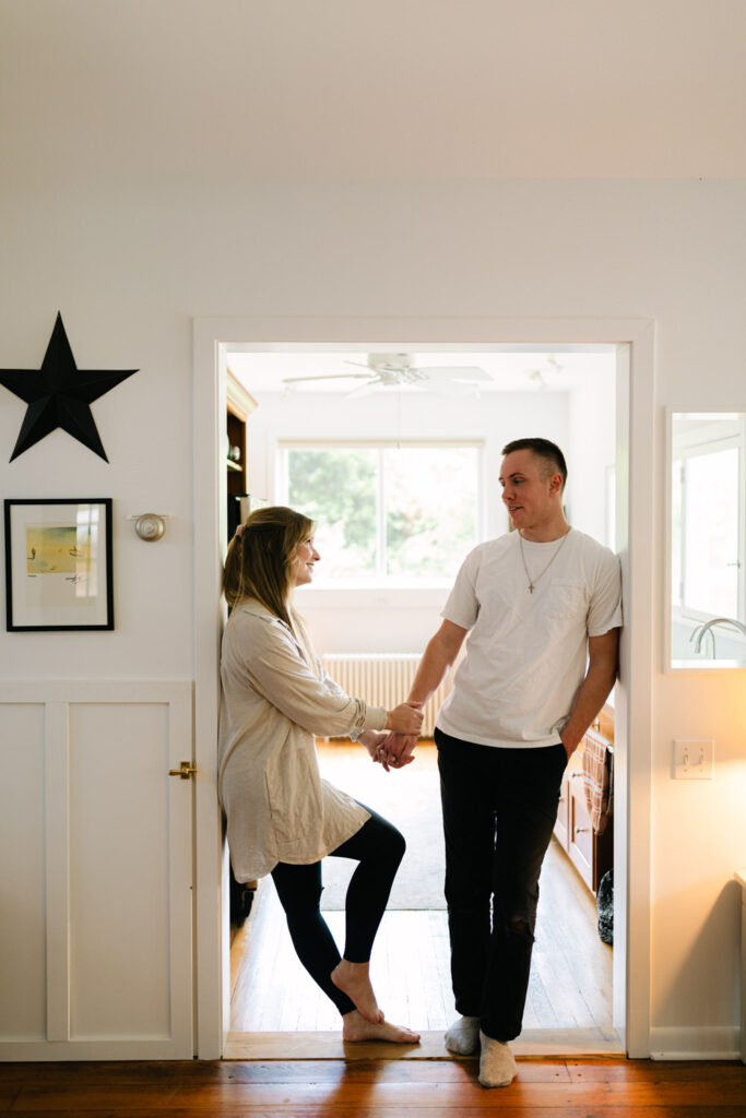 couple posing for pictures indoors