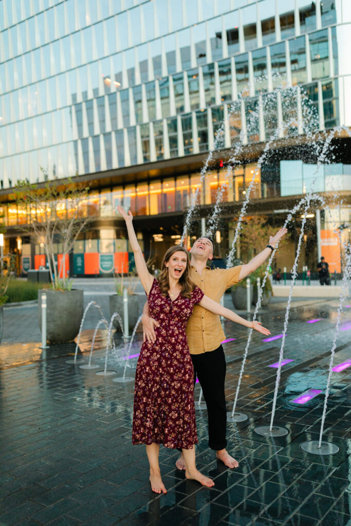 couple dancing in fountain at the wharf