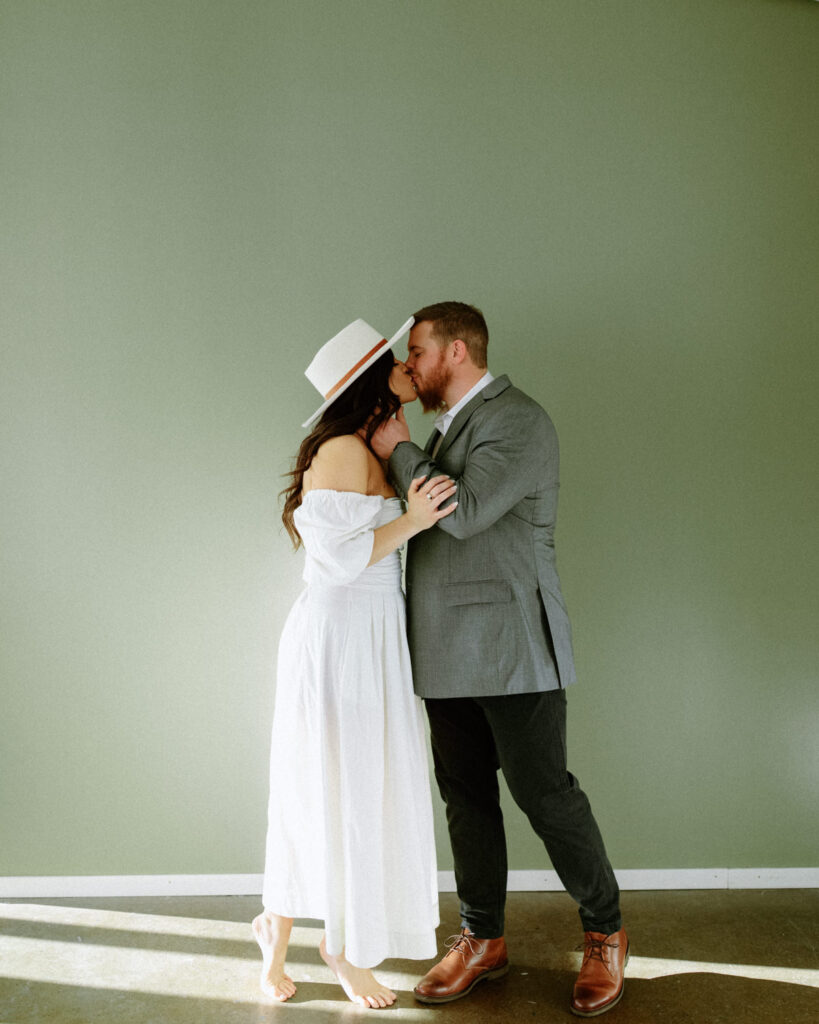 couple kissing for editorial engagement photos