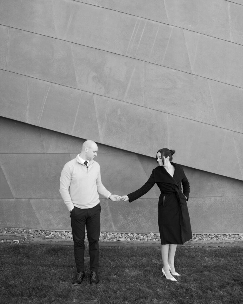 couple posing for engagement pictures in black and white