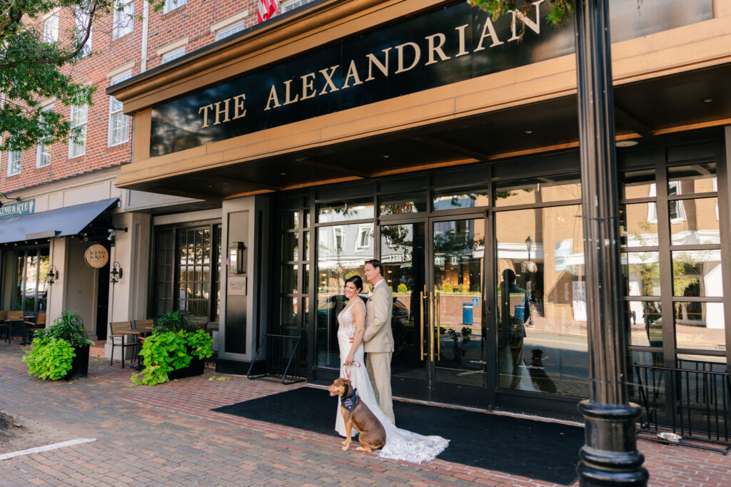 Bride and groom with their dog outside The Alexandrian during their Alexandrian Hotel wedding in Old Town Alexandria, Virginia.