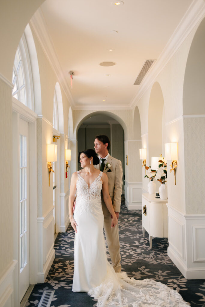 Bride and groom posing together after their first look at The Alexandrian Hotel in Old Town Alexandria, Virginia